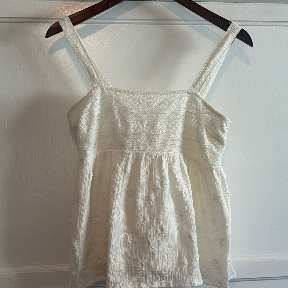 White Embroidered Sleeveless Peplum Top